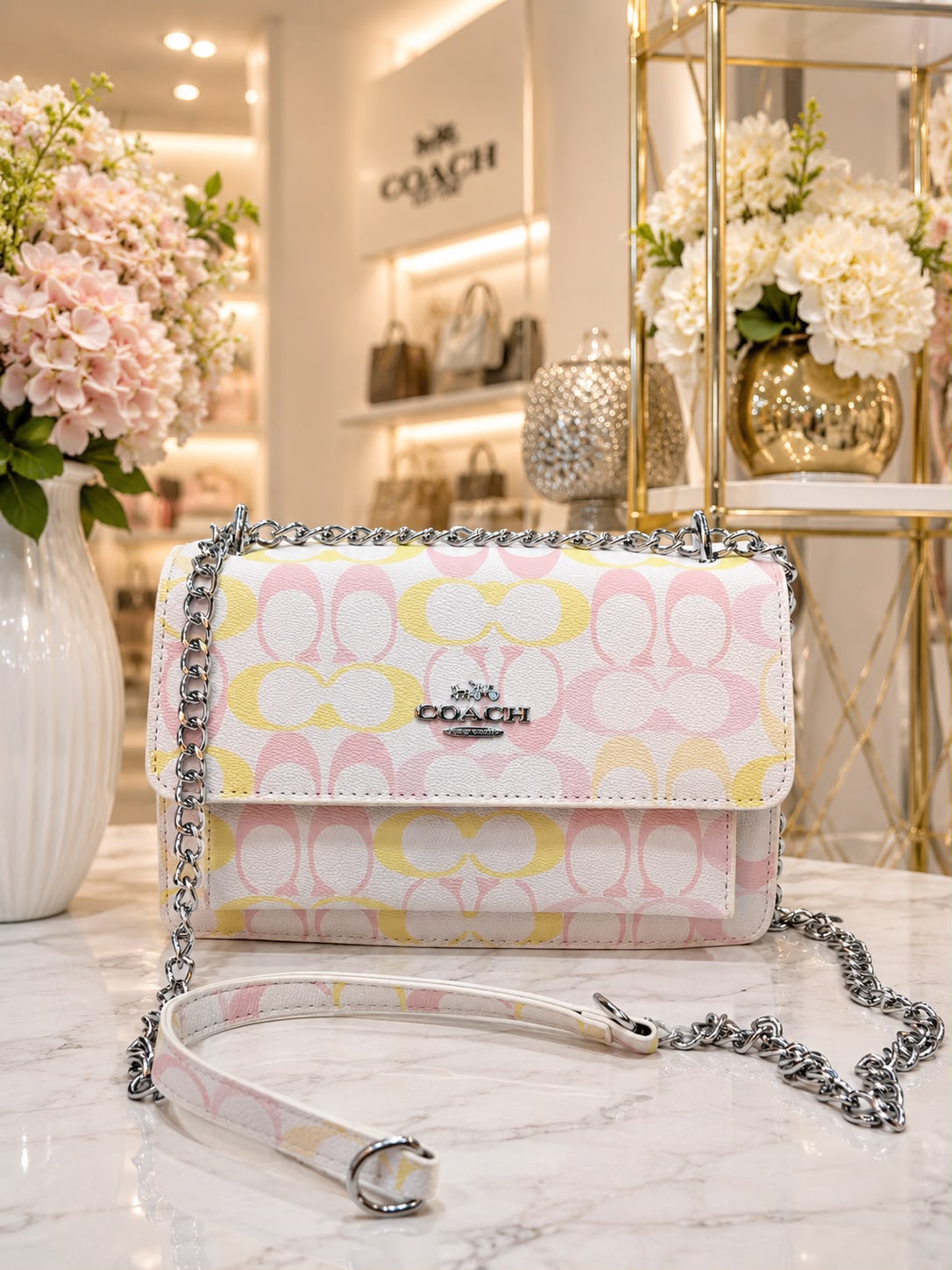 BOLSO COACH CLARO