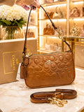 BOLSO COACH CAMEL