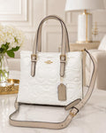 PLAYERA COACH BLANCO-CAFÉ